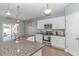 Modern kitchen with granite countertops and stainless steel appliances at 360 Hillsborough Dr., Conway, SC 29526