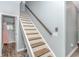 Modern staircase with wooden steps and metal railing at 360 Hillsborough Dr., Conway, SC 29526