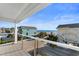 Balcony view overlooking the beach, ocean, and other houses at 411A Ocean Blvd. S, Surfside Beach, SC 29575