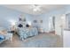Guest bedroom with coastal decor, comfortable bed, and wicker seating at 411A Ocean Blvd. S, Surfside Beach, SC 29575
