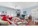 Living room with fireplace, comfortable seating, and beach-themed decor at 411A Ocean Blvd. S, Surfside Beach, SC 29575