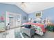 Light and airy main bedroom with vaulted ceiling, coastal decor, and balcony access at 411A Ocean Blvd. S, Surfside Beach, SC 29575