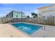 Community pool area with wooden fence and nearby beach homes at 411A Ocean Blvd. S, Surfside Beach, SC 29575