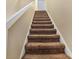 Carpeted staircase with white railings at 4486 Little River Inn Ln. # 2105, Little River, SC 29566