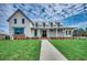 Two story farmhouse exterior with landscaping at 493 Ayrhill Loop, Myrtle Beach, SC 29588