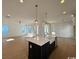 Island kitchen with white cabinets and quartz countertops at 493 Ayrhill Loop, Myrtle Beach, SC 29588