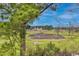 Scenic view of a golf course with a clubhouse in the background at 5050 Windsor Green Way # 304, Myrtle Beach, SC 29579