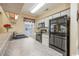 Kitchen with black appliances, white cabinets, and granite-look counters at 5050 Windsor Green Way # 304, Myrtle Beach, SC 29579