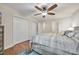 Bright bedroom with a queen-size bed, double door closet, and ceiling fan at 58 Pool Pl. # 73, Georgetown, SC 29440