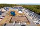 Aerial view of townhouses community, featuring a pond and playground at 608 Montenegro Way # E, Myrtle Beach, SC 29579