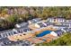 Aerial view of townhouses with playground and pond at 608 Montenegro Way # E, Myrtle Beach, SC 29579
