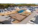 Aerial view showing townhouses, playground, pond, and parking at 608 Montenegro Way # E, Myrtle Beach, SC 29579