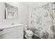 Clean bathroom with a shower/tub combo and seashell decor at 608 Montenegro Way # E, Myrtle Beach, SC 29579