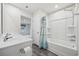 Bathroom with tub, double vanity, and linen closet at 608 Montenegro Way # E, Myrtle Beach, SC 29579