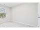 Bright bedroom with neutral carpeting and large window at 608 Montenegro Way # E, Myrtle Beach, SC 29579