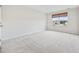Bright bedroom with plush carpeting and window views at 608 Montenegro Way # E, Myrtle Beach, SC 29579