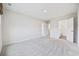 Spacious bedroom with neutral carpeting and ensuite bathroom access at 608 Montenegro Way # E, Myrtle Beach, SC 29579
