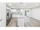 Modern kitchen with stainless steel appliances and an island at 608 Montenegro Way # E, Myrtle Beach, SC 29579