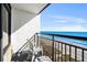 Relaxing balcony with chairs and a table overlooking the ocean at 6804 N Ocean Blvd. # 1215, Myrtle Beach, SC 29572