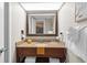 Bathroom with a vanity sink, mirror, and toiletries at 6804 N Ocean Blvd. # 1215, Myrtle Beach, SC 29572