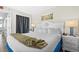 Bedroom featuring white bedding and coastal decor at 6804 N Ocean Blvd. # 1215, Myrtle Beach, SC 29572