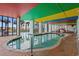 Indoor pool with colorful ceiling and outdoor views at 6804 N Ocean Blvd. # 1215, Myrtle Beach, SC 29572