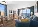 Living and dining area with ocean view and blue sofa at 6804 N Ocean Blvd. # 1215, Myrtle Beach, SC 29572