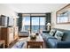 Living room with ocean views, comfortable seating, and a TV at 6804 N Ocean Blvd. # 1215, Myrtle Beach, SC 29572