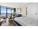 Living area with a sofa bed, coffee table, and ocean views through large windows at 6804 N Ocean Blvd. # 1215, Myrtle Beach, SC 29572