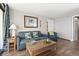Cozy living room with a pull-out sofa, coffee table, and coastal decor at 6804 N Ocean Blvd. # 1215, Myrtle Beach, SC 29572