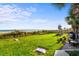 Outdoor green space with cornhole, lounge chairs, and ocean views at 6804 N Ocean Blvd. # 1215, Myrtle Beach, SC 29572