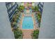 Relaxing pool with lounge chairs surrounded by palm trees at 6804 N Ocean Blvd. # 1215, Myrtle Beach, SC 29572