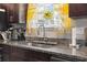 Kitchen sink with granite countertops and a yellow curtain at 724 Hobonny Loop, Longs, SC 29568