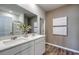 Modern bathroom with dual vanity sinks, white cabinets, and wood-look flooring at 958 Laconic Dr., Myrtle Beach, SC 29588