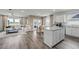 Open-concept living area with a kitchen island, ample seating, and wood-look flooring at 986 Laconic Dr., Myrtle Beach, SC 29588