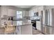 Modern kitchen with white cabinets, stainless steel appliances, and an island at 998 Laconic Dr., Myrtle Beach, SC 29588