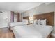 Hotel-style bedroom with two double beds, nightstands, lamps, and wooden headboards at 1501 S Ocean Blvd. # 1243, Myrtle Beach, SC 29577