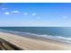 Scenic ocean view with sandy beach from a balcony at 1501 S Ocean Blvd. # 1243, Myrtle Beach, SC 29577