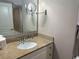 Bathroom vanity with sink, mirror, and toiletries at 2301 S Ocean Blvd. # 1002, North Myrtle Beach, SC 29582