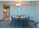 Dining area with a table and chairs adjacent to the kitchen at 2301 S Ocean Blvd. # 1002, North Myrtle Beach, SC 29582