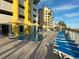 Community pool area with lounge chairs and ocean view at 2301 S Ocean Blvd. # 1002, North Myrtle Beach, SC 29582