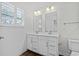 Modern bathroom with white vanity, double sinks, and wood-look flooring at 308 Golan Circle # C, Myrtle Beach, SC 29579
