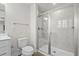 Clean bathroom featuring tiled shower with built-in bench, wood-look floors, and white vanity at 308 Golan Circle # C, Myrtle Beach, SC 29579