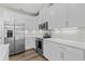 Bright kitchen featuring white cabinets, stainless steel appliances, and sleek countertops at 308 Golan Circle # C, Myrtle Beach, SC 29579