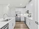 Modern kitchen with white cabinets, stainless steel appliances, and white countertops at 308 Golan Circle # C, Myrtle Beach, SC 29579