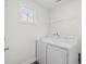 Laundry room with washer, dryer, and overhead shelving at 308 Golan Circle # C, Myrtle Beach, SC 29579