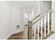 View of the staircase and wood-look flooring from the foyer at 308 Golan Circle # C, Myrtle Beach, SC 29579
