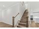 Wooden staircase with white railing leading to the upper level at 308 Golan Circle # C, Myrtle Beach, SC 29579