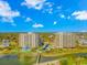 Aerial view of a beachfront property with two high-rise buildings, a pool, and a bridge at 415 Ocean Creek Dr. # 2373, Myrtle Beach, SC 29572