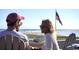 Couple enjoying ocean views from a balcony at 415 Ocean Creek Dr. # 2373, Myrtle Beach, SC 29572